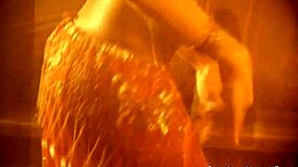 exotic dancer teases with ripped clothes revealing sensual curves