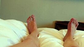 brunette babe masturbates feet in hotel room close-up