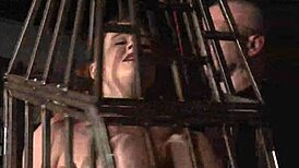 Submissive babe isabel dean locked in cage for feet bastinado whipping bondage punishment fetish bdsm slave style.