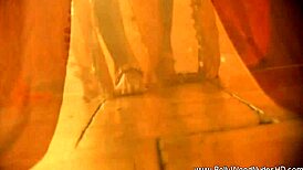 exotic dancer teases with ripped clothes revealing sensual curves