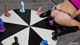 horny petite teen spins wheel of huge dildos anal toys for rough orgasm win