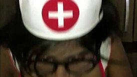 Young latina nurse cares for patient in hospital