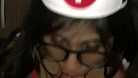 Young latina nurse cares for patient in hospital