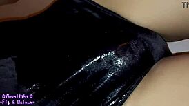 trans crossdresses in navy blue swimsuit slathered slippery lotion