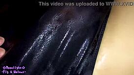 trans crossdresses in navy blue swimsuit slathered slippery lotion