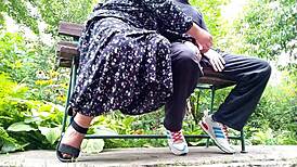 the mature chubby BBW MILF gives a sloppy handjob outdoors before taking huge cock deep