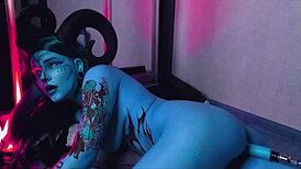 Tattooed blue-eyed slut with huge natural tits moans loud as machine fucks her hard!