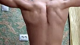 After school, the skinny flexible bodybuilder flexes his toned muscles in homemade amateur display for admirers.