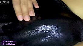 trans crossdresses in navy blue swimsuit slathered slippery lotion