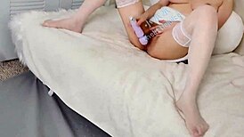 this young asian amateur slips off stockings and squirts hard while cumming on camera