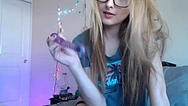 Cute tattooed glasses girl flaunts massive boobs on webcam!