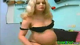 blonde pregnant beauty flaunts huge boobs on live webcam show