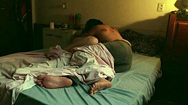real couple kisses passionately with big tits and ass on rainy day