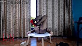 Think this nice lady's striptease shines in pantyhose heels around round table?