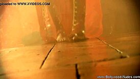Exotic brunette milf strips sensually in oriental dance tease.