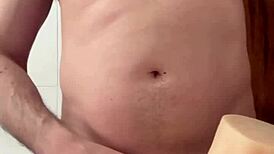 Alone at home she plays with her pierced pussy toy