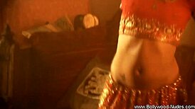 Exotic brunette milf strips sensually in oriental dance tease.