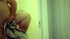 man showers with his small cock exposed