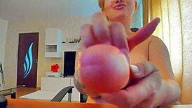 Hey girl with those massive tits scratches dildo before deep sucking it off