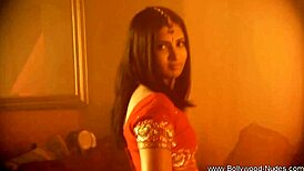 Exotic brunette milf strips sensually in oriental dance tease.