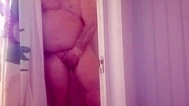 man showers with his small cock exposed
