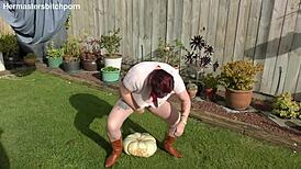 kiwi trashy milf squats her huge slutty body on massive pumpkin toilet seat in backyard garden dirt 😏