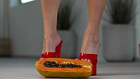 petite girl crushes fruits under high heels foot fetish tease