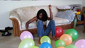 french ebony with big tits blows up balloons