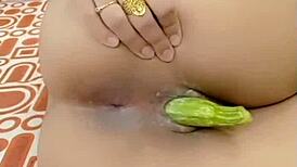 Deep vegetable ass fuck makes her moan loud