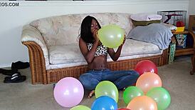 french ebony with big tits blows up balloons