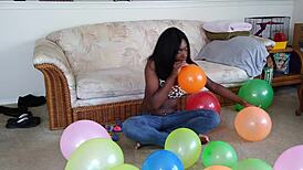 french ebony with big tits blows up balloons