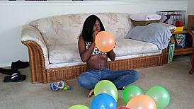french ebony with big tits blows up balloons