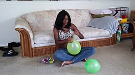 french ebony with big tits blows up balloons