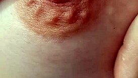 close-up view of braless amateur's hard nipples poking through thin fabric