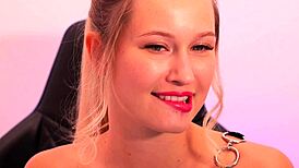 a beauty with red lipstick seductively sucks and fingers herself
