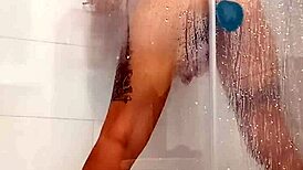 She grabs her toy feeling horny under the steamy shower spray.