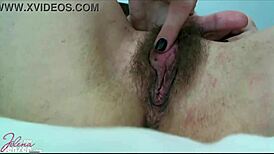 jelena jensen spreads her legs teasing her big hairy pussy before fingering her swollen clit deep