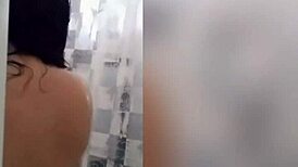 cute latina teen with tattoos showers sensually on webcam