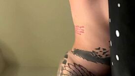 big tit girlfriend lola maverick strips teases tattooed body close-up in bed