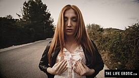 Redhead writhes in horny climax from nipple clamps gag