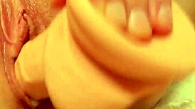 Hey watch her shove that dildo deep into her tight shaved creamy pussy close up