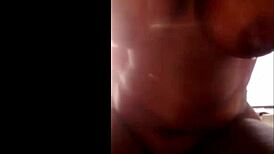 She grabs her dildo and fucks those perfect tits right outside moaning to orgasm