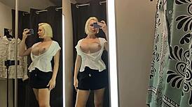 suggestive blonde flashes see-through panties and big tits in public changing room
