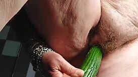 GRANNY'S HAIRY PUSSY FUCKED WITH CUCUMBER!