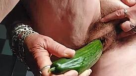 GRANNY'S HAIRY PUSSY FUCKED WITH CUCUMBER!