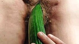 GRANNY'S HAIRY PUSSY FUCKED WITH CUCUMBER!