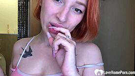 Why does this seductive redhead's amazing tattooed ass make you wanna finger her now?