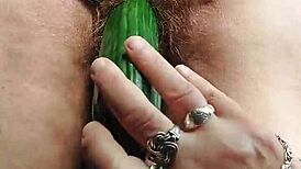 GRANNY'S HAIRY PUSSY FUCKED WITH CUCUMBER!
