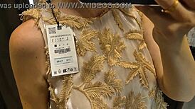 suggestive blonde flashes see-through panties and big tits in public changing room