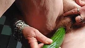 GRANNY'S HAIRY PUSSY FUCKED WITH CUCUMBER!
